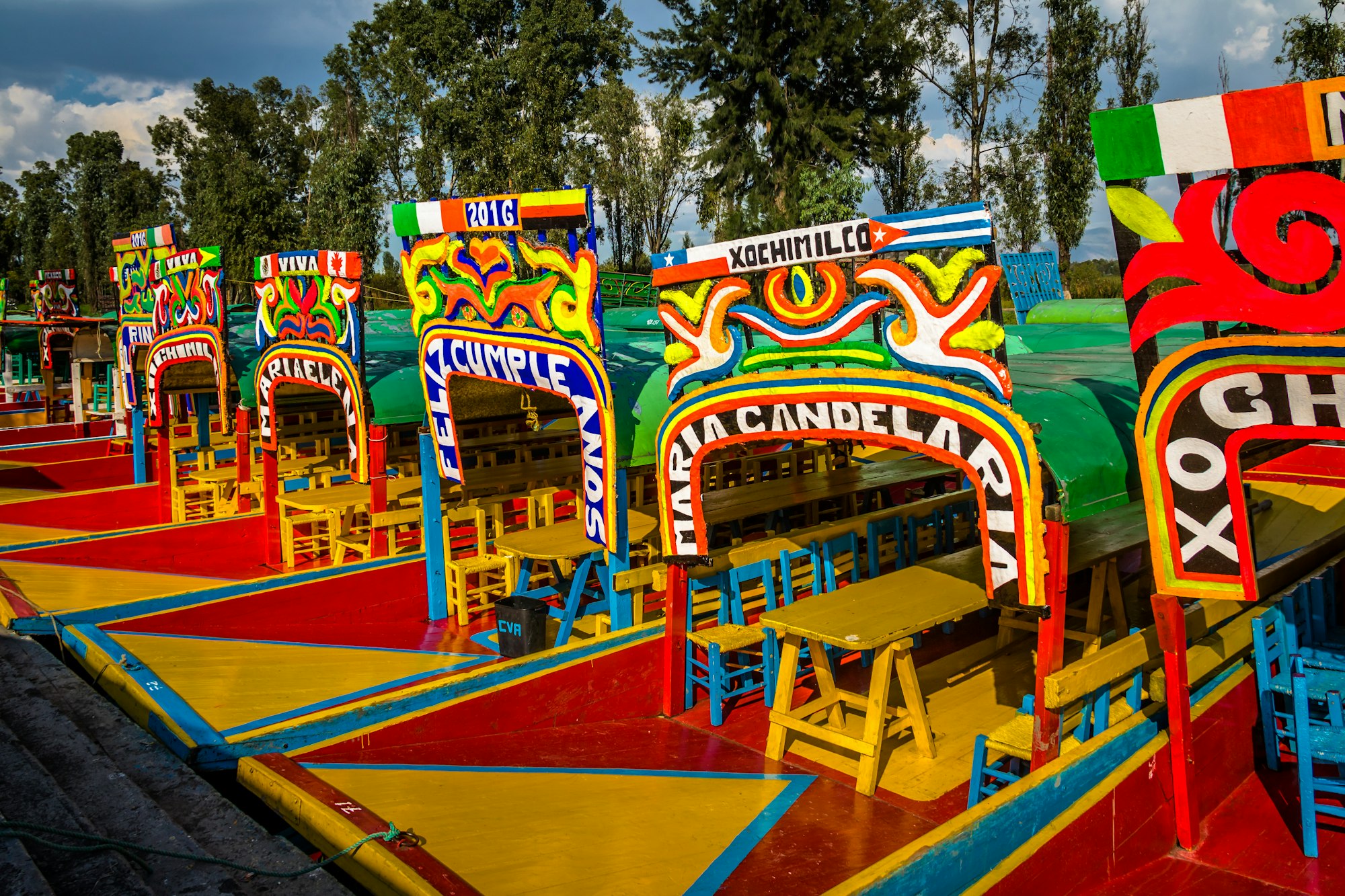 Colourful Mexican boats with women names at Xochimilco's Floating Gardens - Mexico City, Mexico